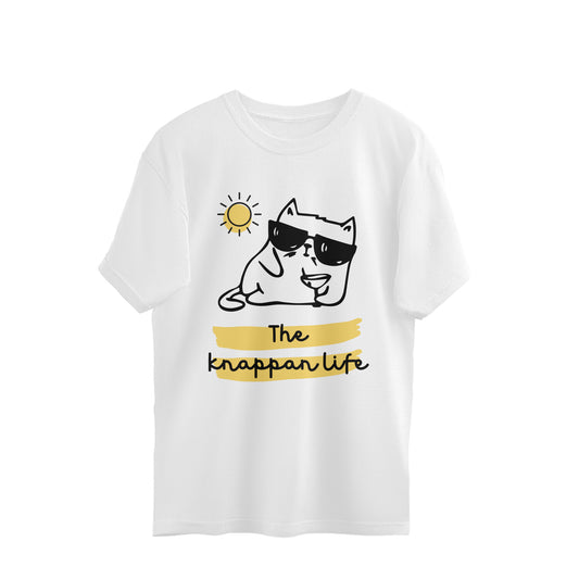 White oversized unisex tshirt printed with a line drawing of a cat in sunglasses reclining with a cocktail under a sun, with the words The knappan life highlighted in yellow below