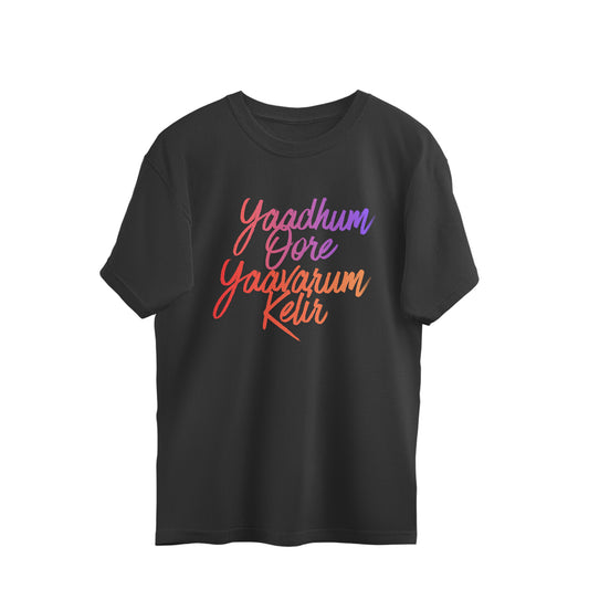 Yaadhum Oore Yaavarum Kelir printed in pink and orange script on a black oversized unisex t-shirt